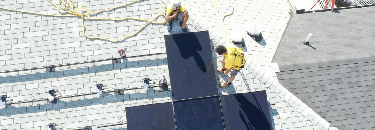 Team members from Better Tomorrow Solar are installing solar panels in Atlanta, GA