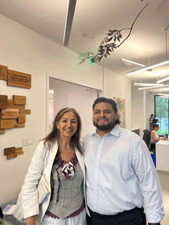 Roji and Gustavo, possibly solar company employees or homeowners in Atlanta, GA