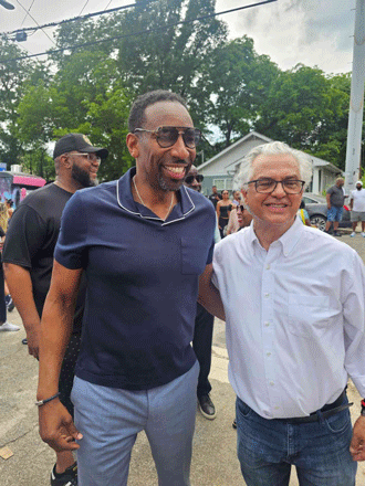A large, completed solar array installed on a dark shingled residential roof in Atlanta, GA