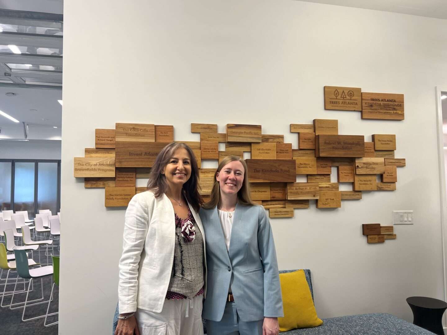 Roji and Alicia, likely solar installation team members or satisfied customers, in Atlanta, GA