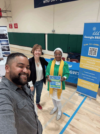 Solar technician on a roof securing mounting hardware before panel installation in Atlanta, GA